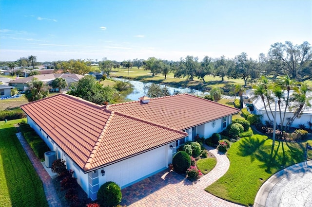 birds eye view of property featuring a water view