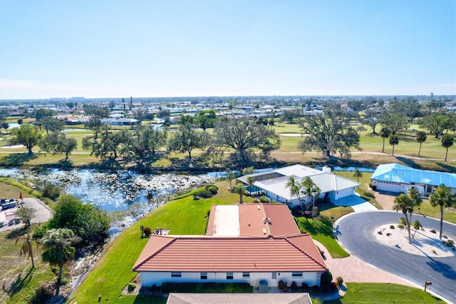 drone / aerial view with a water view