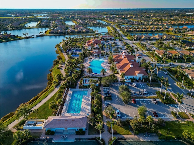 birds eye view of property with a water view