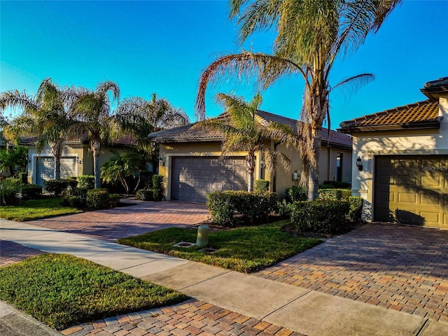 mediterranean / spanish-style home featuring a garage