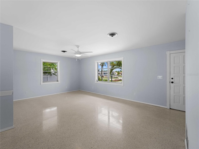 unfurnished room with ceiling fan