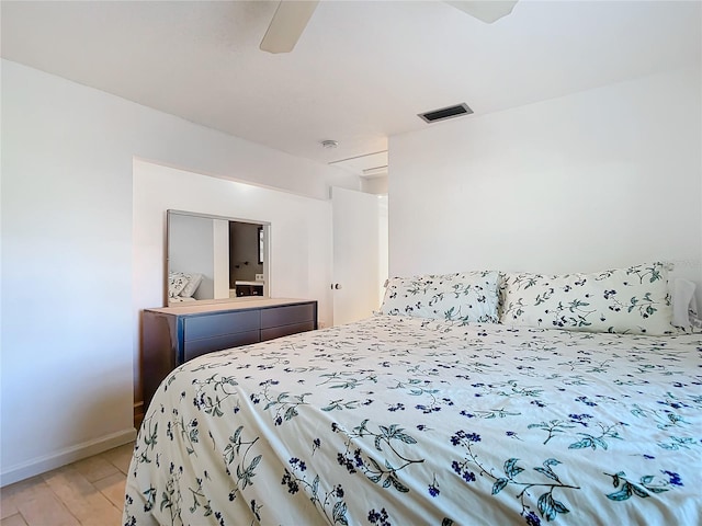 bedroom with ceiling fan and light hardwood / wood-style floors