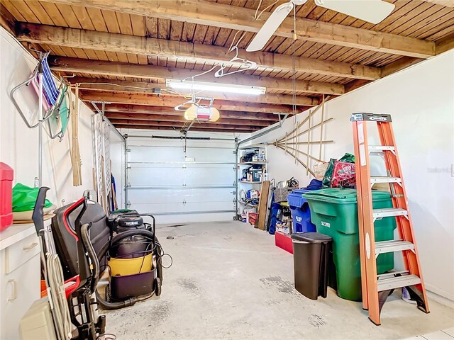 garage with a garage door opener and wooden ceiling