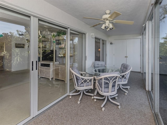 sunroom / solarium with ceiling fan