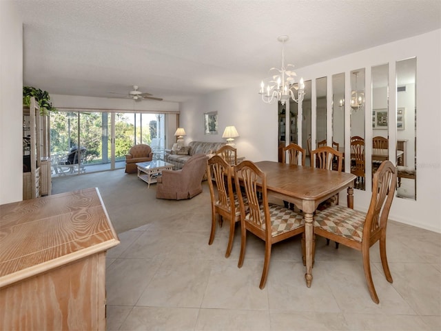 dining room featuring light tile patterned flooring and a textured ceiling