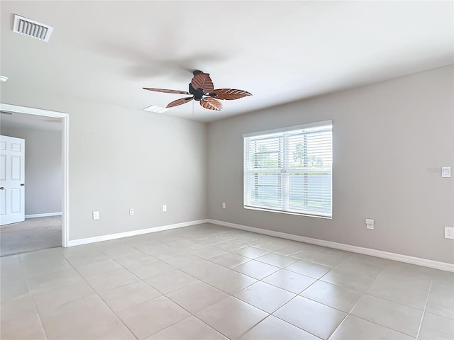 unfurnished room with light tile patterned flooring and ceiling fan