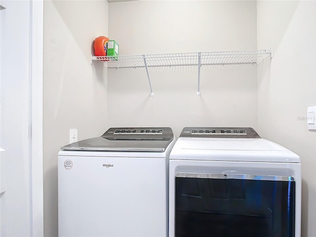 clothes washing area featuring washing machine and dryer