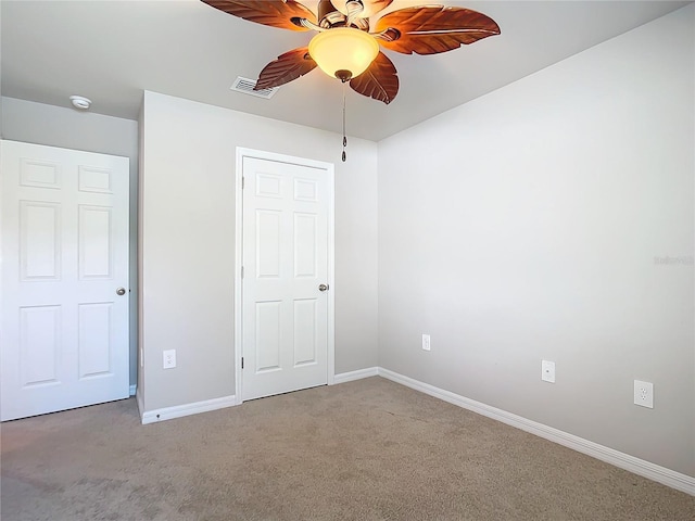 unfurnished bedroom with carpet floors and ceiling fan