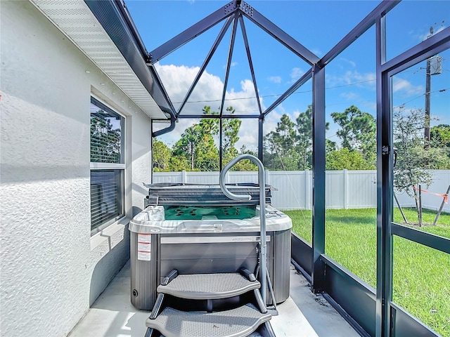 sunroom / solarium featuring a jacuzzi