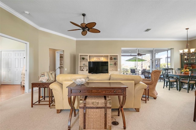 living room featuring light colored carpet, ornamental molding, ceiling fan with notable chandelier, and a textured ceiling