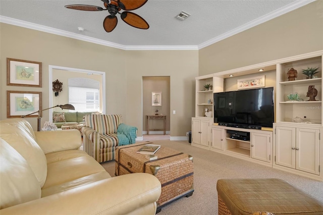 living room featuring crown molding, light colored carpet, ceiling fan, and a textured ceiling