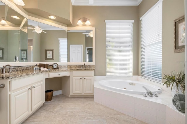 bathroom with vanity, tiled tub, crown molding, and ceiling fan