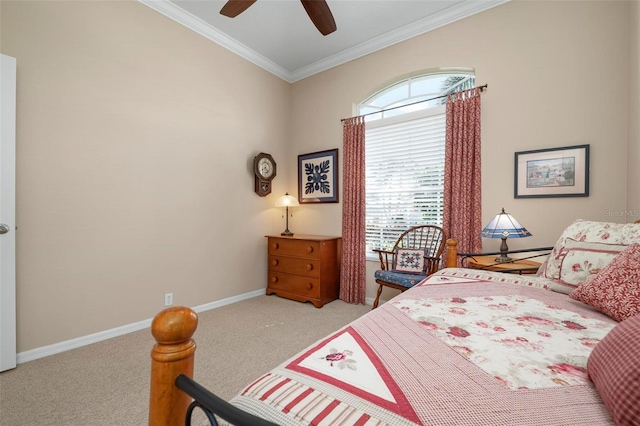 carpeted bedroom featuring ornamental molding and ceiling fan