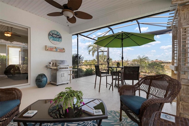 sunroom featuring ceiling fan