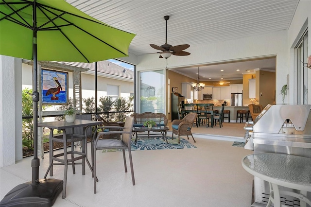 exterior space with ceiling fan with notable chandelier