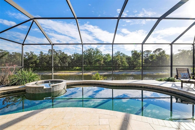 view of pool featuring glass enclosure, an in ground hot tub, a water view, and a patio