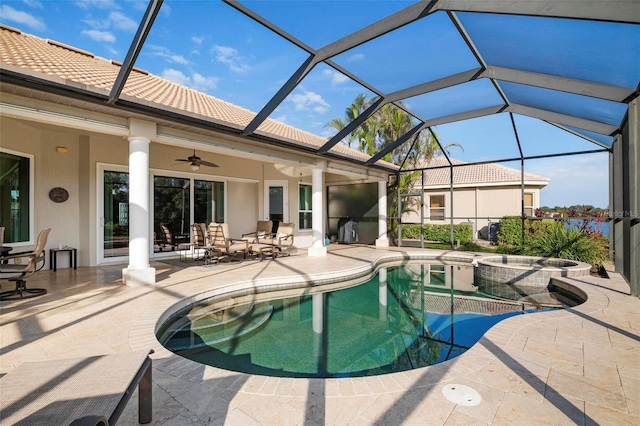 view of pool featuring an in ground hot tub, a patio area, ceiling fan, and a lanai