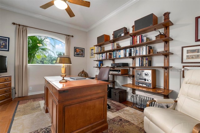 home office featuring ceiling fan, light hardwood / wood-style flooring, and crown molding