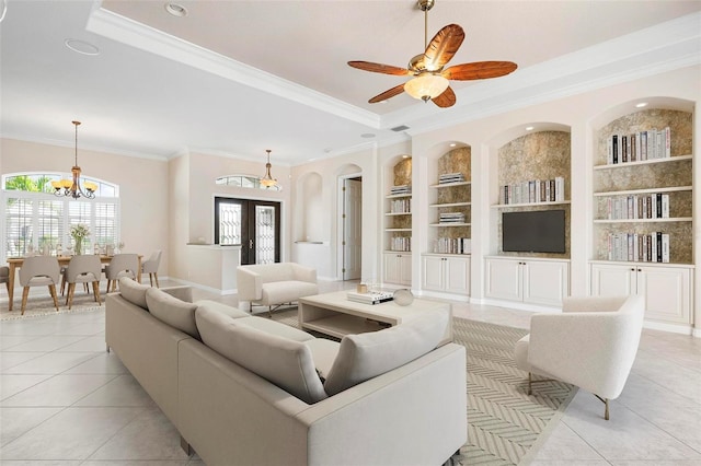 living area with light tile patterned floors, built in features, and crown molding