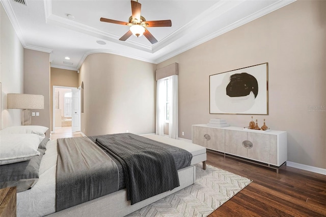 bedroom with recessed lighting, ceiling fan, a tray ceiling, ornamental molding, and wood finished floors