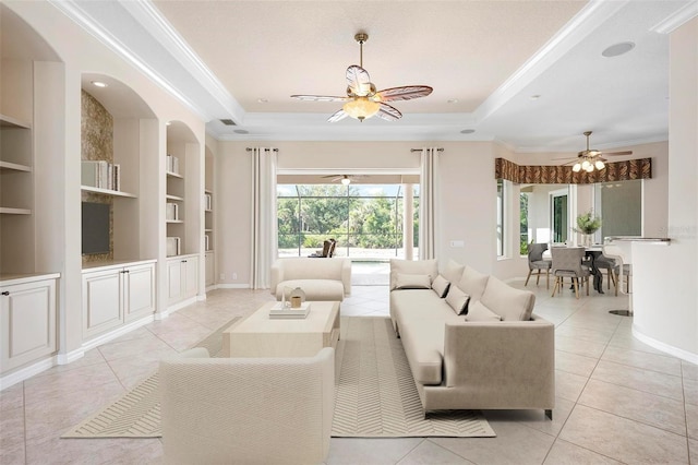 living room with light tile patterned floors, ceiling fan, and built in shelves