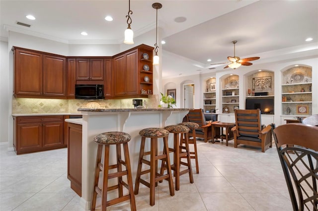 kitchen with light tile patterned floors, crown molding, open shelves, black microwave, and visible vents
