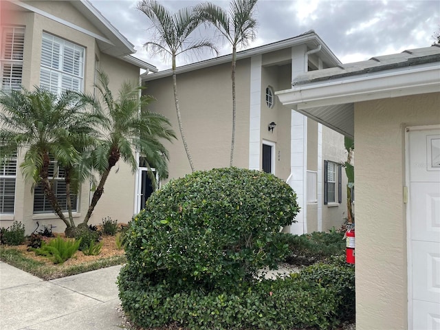 view of side of property with stucco siding