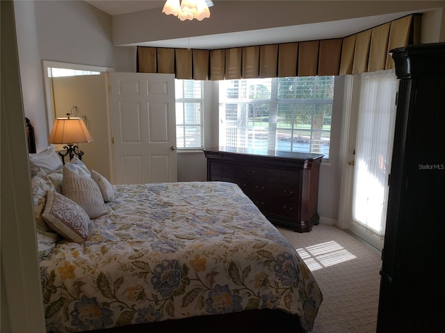 bedroom with light colored carpet