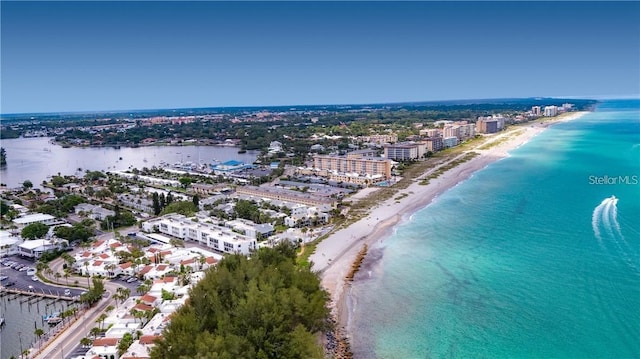 drone / aerial view with a view of the beach, a water view, and a view of city