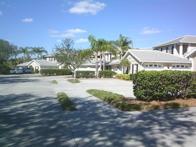 exterior space with a residential view and concrete driveway