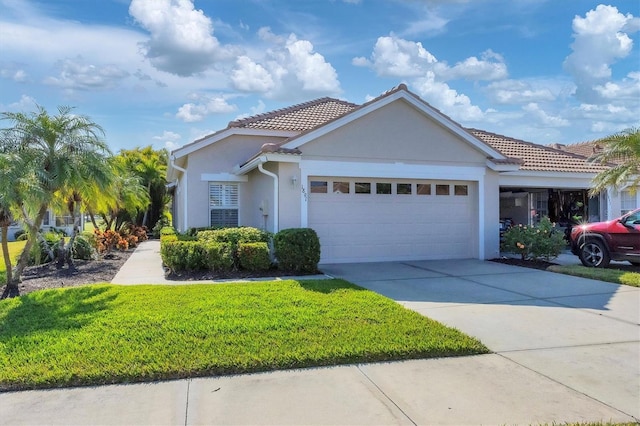 view of front of house with a garage and a front lawn