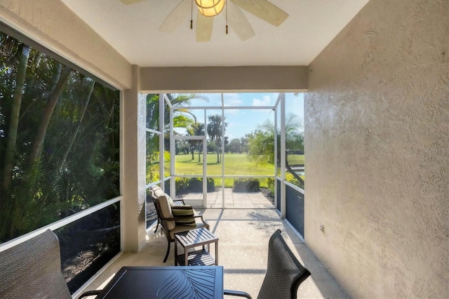 sunroom / solarium with ceiling fan