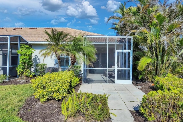 rear view of property featuring central AC