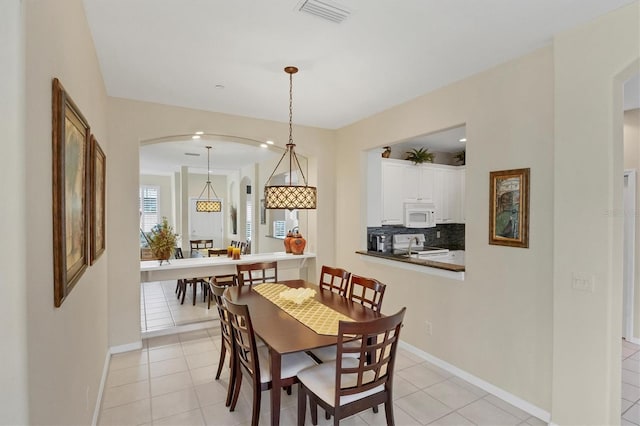 dining room with light tile patterned floors