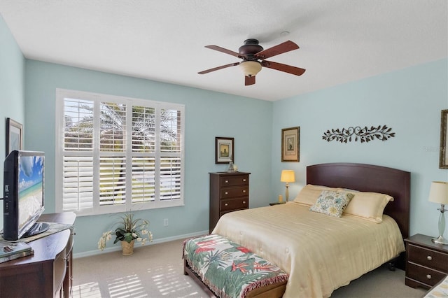 bedroom featuring ceiling fan and carpet flooring