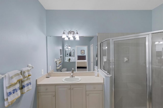 bathroom with walk in shower and vanity