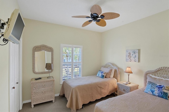 bedroom featuring ceiling fan, a closet, and carpet floors