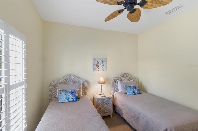 carpeted bedroom with ceiling fan