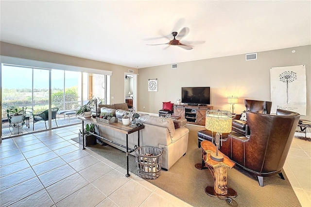 living room featuring ceiling fan and light tile patterned flooring