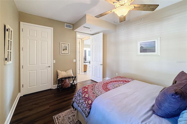 bedroom with ceiling fan and dark wood-type flooring