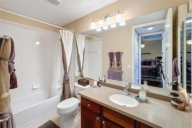 full bathroom featuring toilet, vanity, and shower / bath combination with curtain