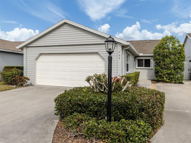 ranch-style house featuring a garage