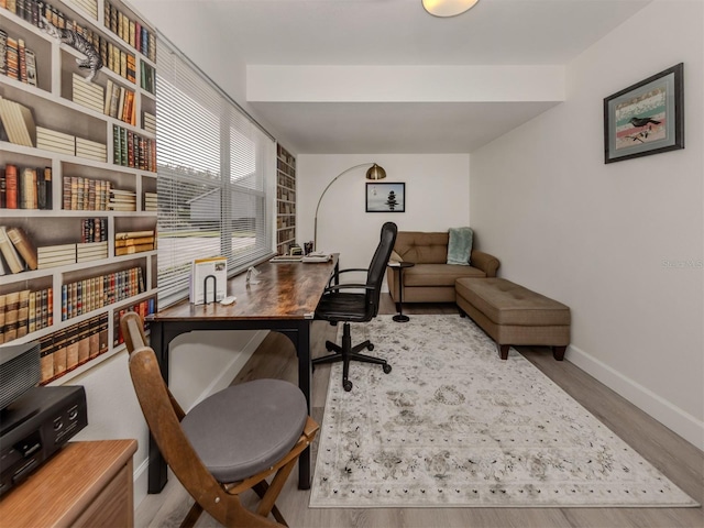 office area with light hardwood / wood-style flooring