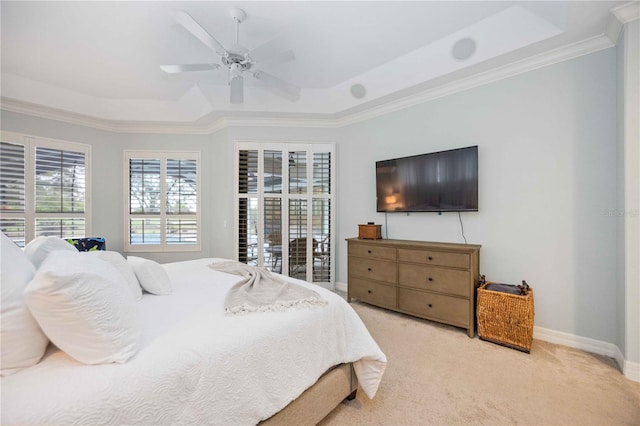 bedroom featuring ceiling fan, crown molding, a raised ceiling, and carpet flooring