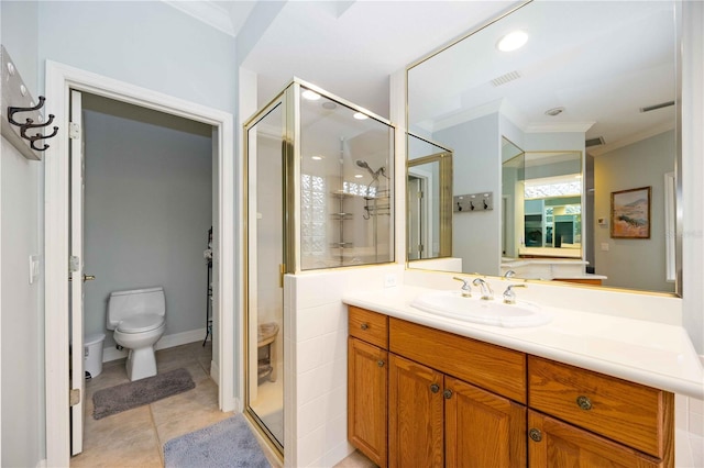 bathroom with toilet, vanity, tile patterned floors, a shower with shower door, and ornamental molding