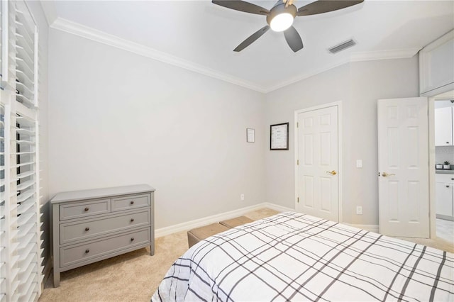 carpeted bedroom featuring ceiling fan and ornamental molding