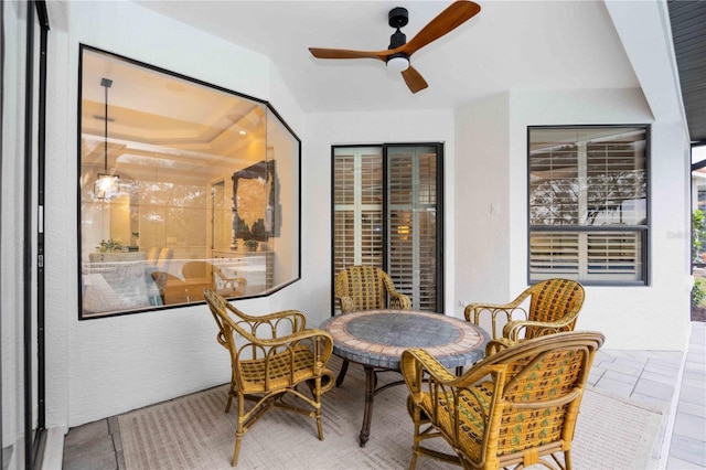 interior space featuring ceiling fan and tile patterned floors