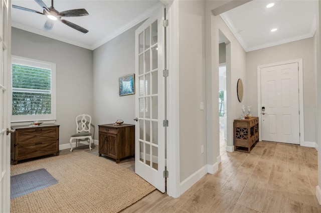 hallway with crown molding and light hardwood / wood-style floors