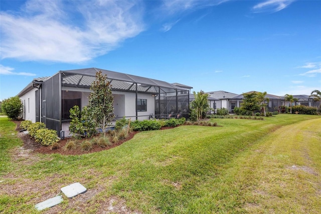 view of yard with glass enclosure