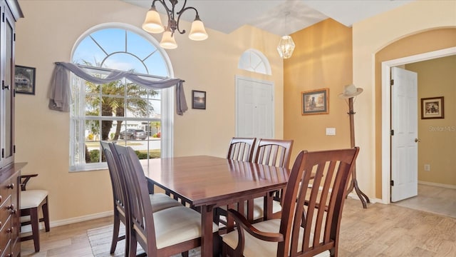 dining room featuring light hardwood / wood-style floors and a chandelier